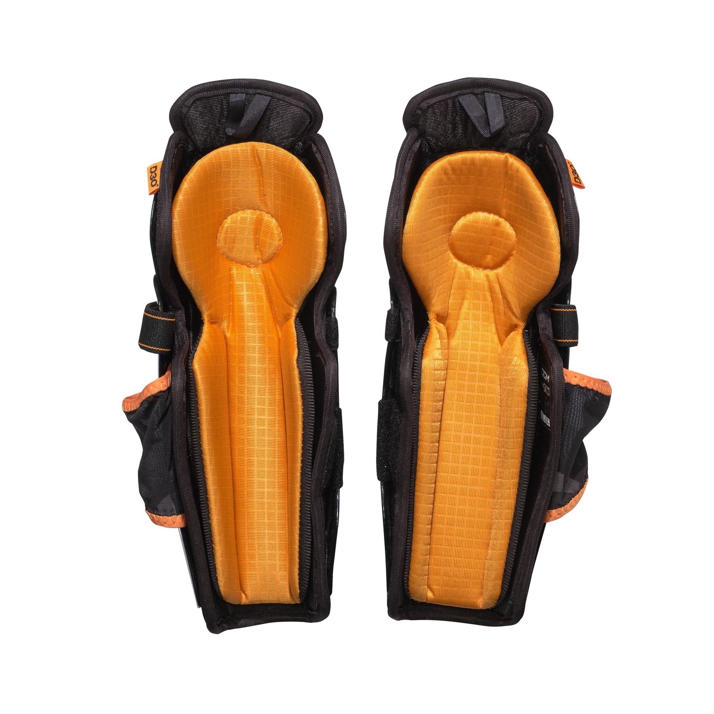A photo of the CCM Tacks XR Pro Youth Hockey Shin Guards in colour black and orange.