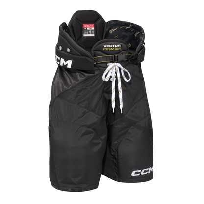 A photo of the CCM Tacks Vector Premier Hockey Pants in colour black, angled view.