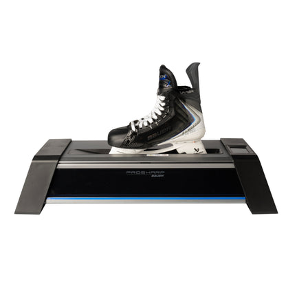 A photo of the BAUER PROSHARP ADVANTEDGE Skate Sharpening Machine in colour black and blue. Bauer Vapor Skate in machine.