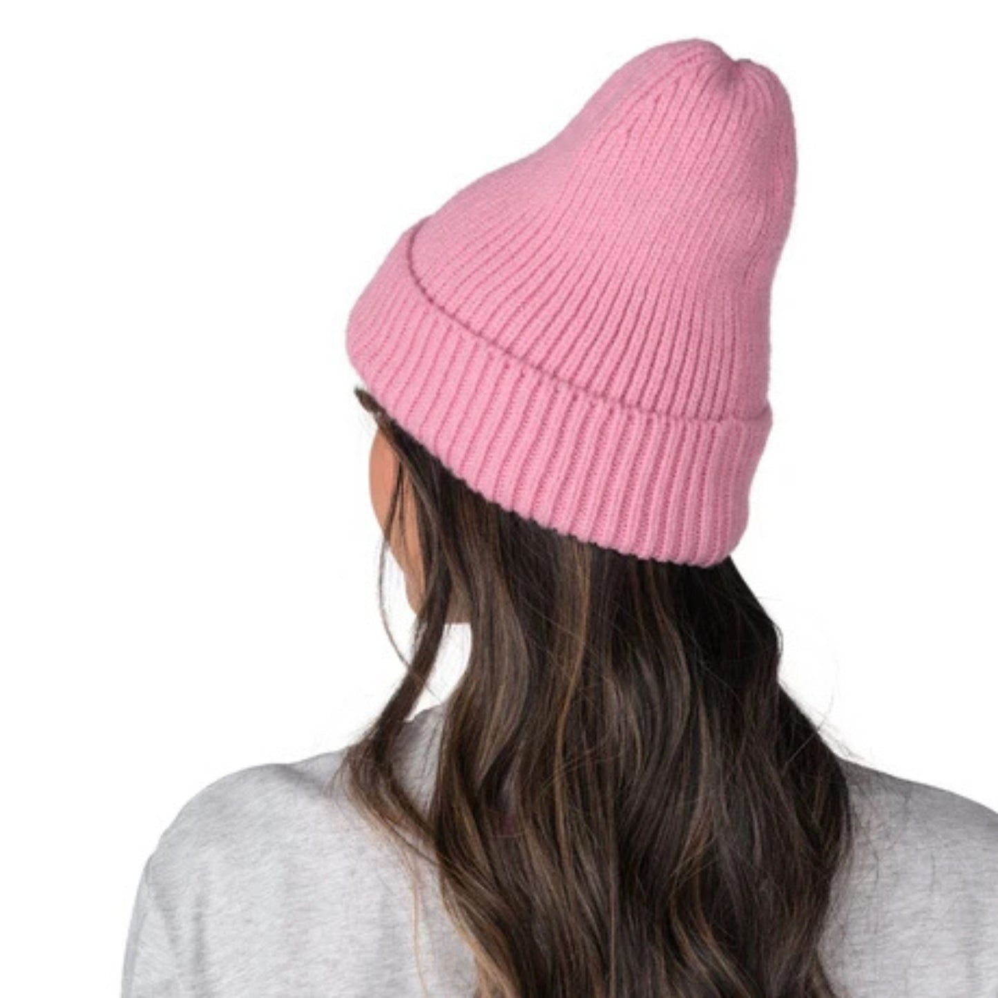 A photo of a woman wearing a grey Barbie shirt and the pink Barbie™ x CCM Cuffed Adult Beanie
