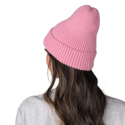 A photo of a woman wearing a grey Barbie shirt and the pink Barbie™ x CCM Cuffed Adult Beanie