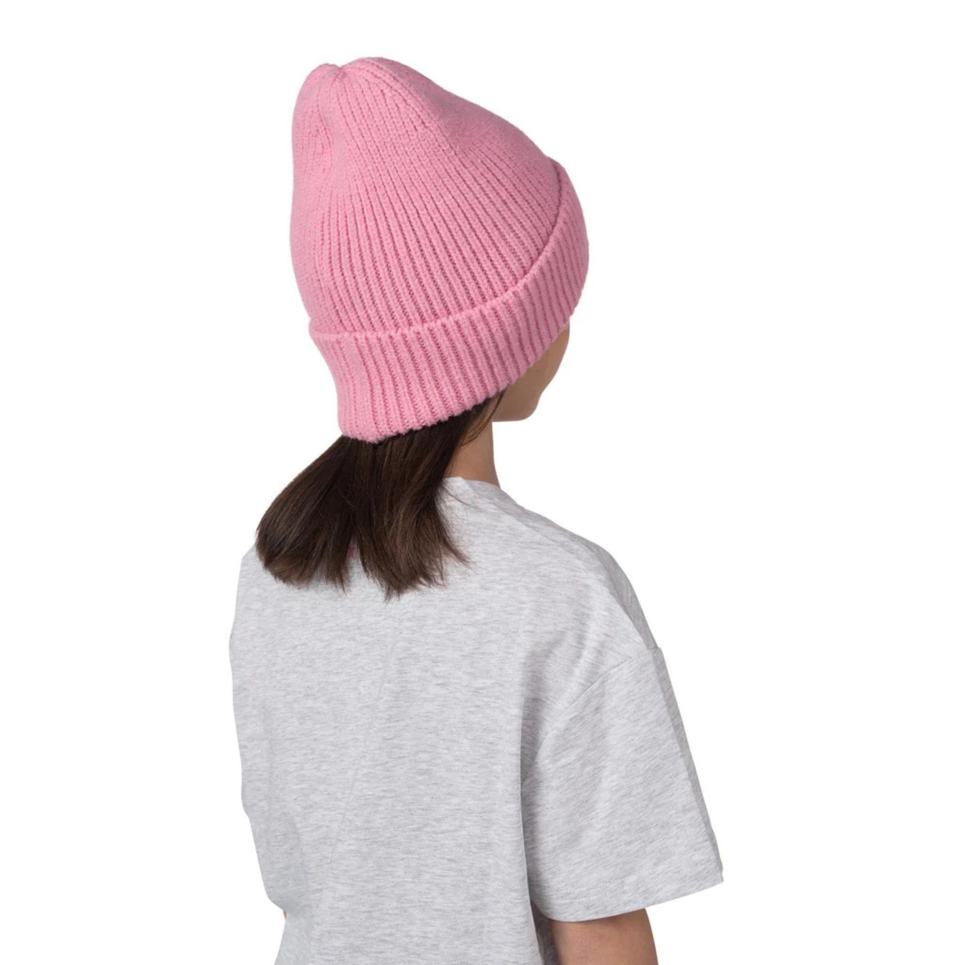 A photo a child in a Grey Barbie shirt wearing the Barbie™ x CCM Cuffed Youth Beanie in colour pink.