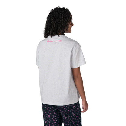 A woman wearing a grey Barbie™ x CCM Grey Goal Getter Short Sleeve T‑Shirt