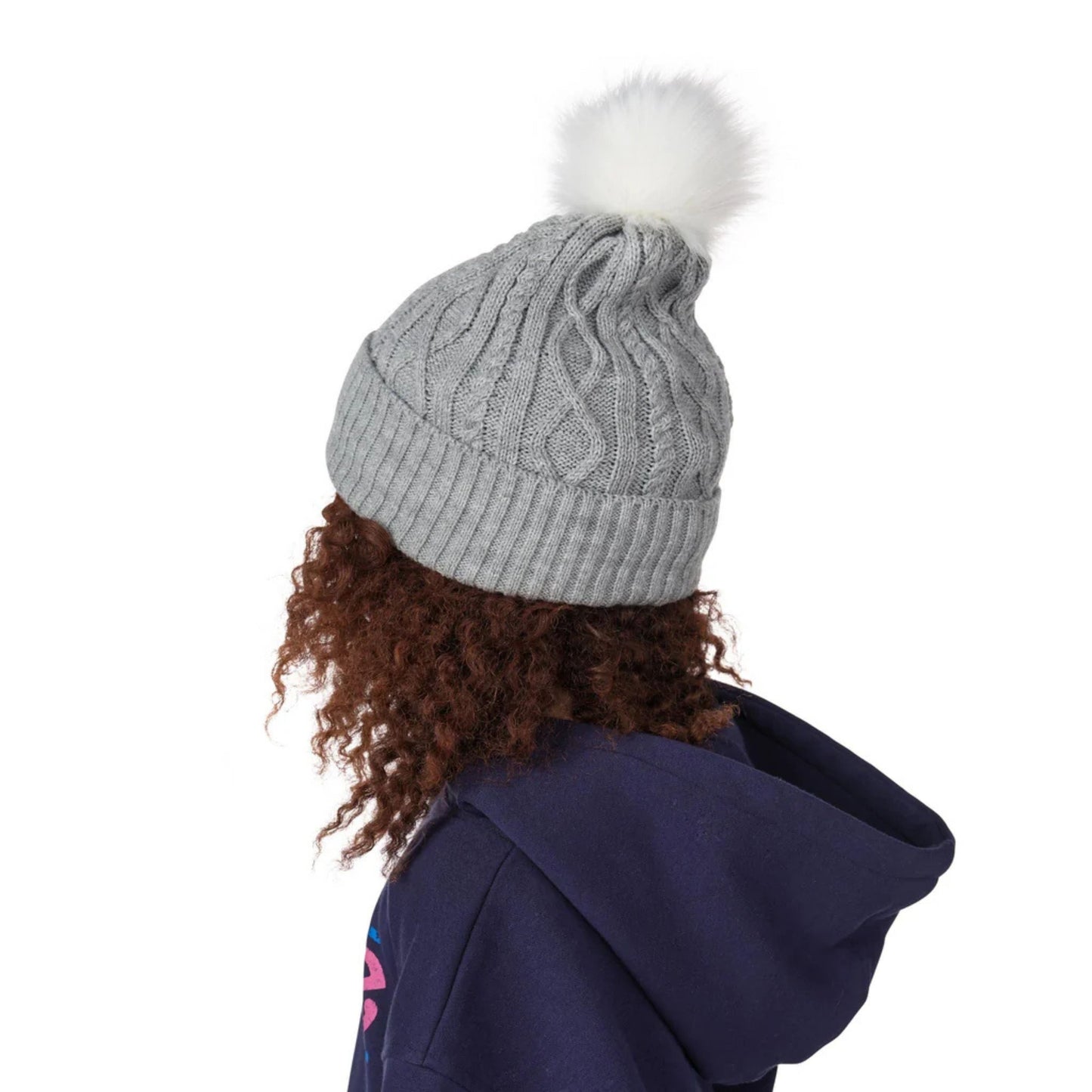 A photo of a child wearing a navy Barbie hoodie sweater and a grey Barbie™ x CCM Grey Pom Knit Youth Toque.