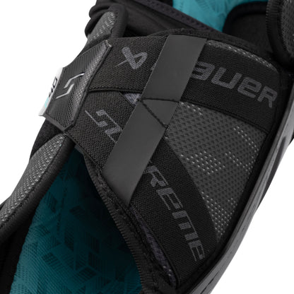A photo of the Bauer Supreme F40 Senior Shin Guard in colour black and blue.