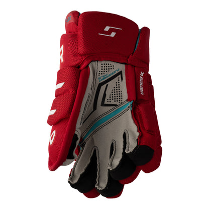 A photo of the Bauer Supreme Fuse Youth Hockey Gloves (2026) in colour red.