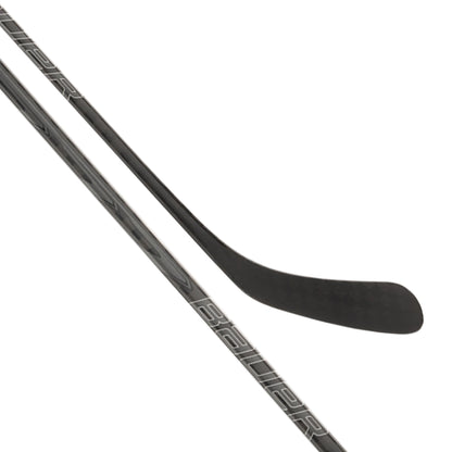 A photo of the Bauer Supreme Pro Hockey Stick (2026) in colour black, with grey Supreme logo.