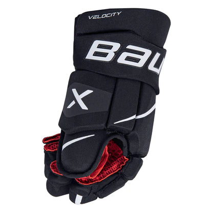 A photo of the Bauer Vapor Velocity Youth Hockey Gloves (2022) - Source Exclusive in colour black and white, side view.