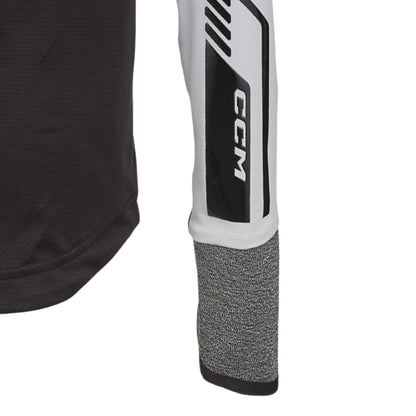 A photo of the CCM FTW Cut Protection Baselayer Long Sleeve Top Youth in colour black and white.