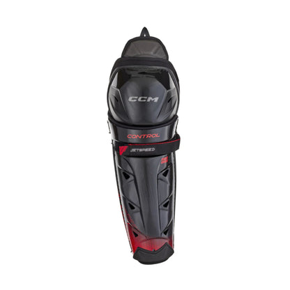 A photo of the CCM JetSpeed Control Junior Hockey Shin Guards in colour black and red.
