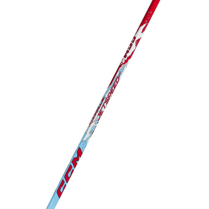 A photo of the CCM JetSpeed FT Youth Hockey Stick (2026) in color blue, white and red with red text.