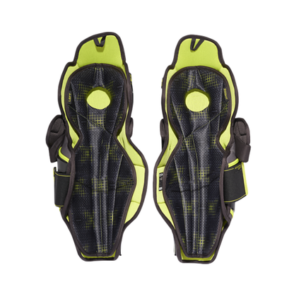 A photo of the CCM TACKS XF80 Hockey Shin Guards Senior in colour black and green.