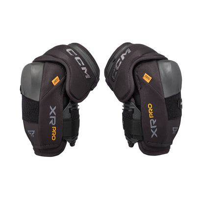 A photo of the CCM Tacks XR Pro Hockey Elbow Pads in colour black and orange.