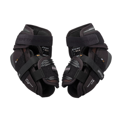 A photo of the CCM Tacks XR Pro Hockey Elbow Pads in colour black and orange.