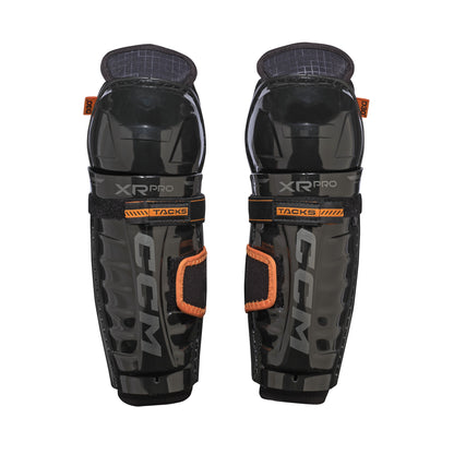 A photo of the CCM Tacks XR Pro Youth Hockey Shin Guards in colour black and orange.