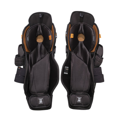 A photo of the CCM Tacks XR Pro Hockey Shin Guards in colour black and orange.