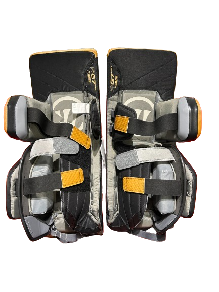 A photo of the Warrior G7 Goalie Leg Pads in colour tan and black, rear view.