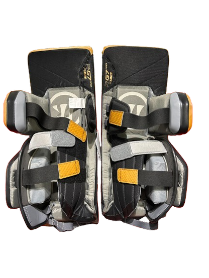 A photo of the Warrior G7 Goalie Leg Pads in colour tan and black, rear view.