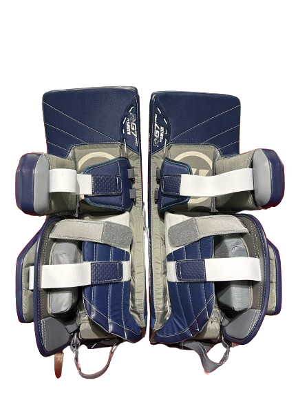 A photo of the Warrior G7 Goalie Leg Pads in colour Navy and white, rear view.