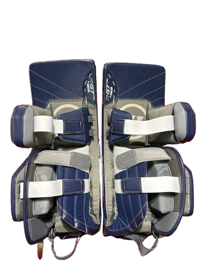 A photo of the Warrior G7 Goalie Leg Pads in colour Navy and white, rear view.