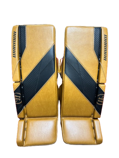 A photo of the Warrior G7 Goalie Leg Pads in colour tan and black. Front view.