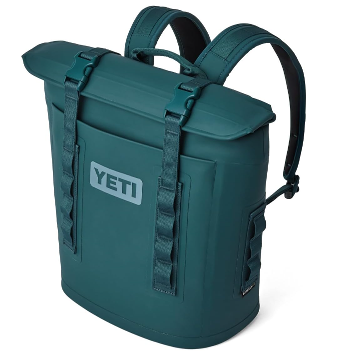 A photo of the Yeti Hopper M12 Soft Cooler Backpack in colour teal side view.