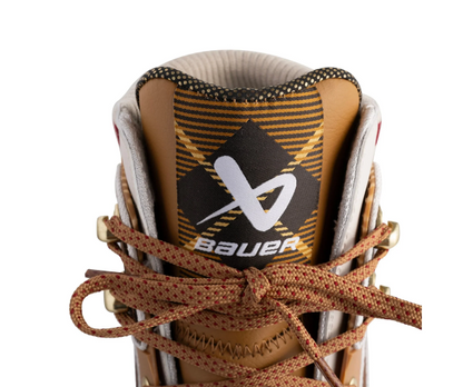 A photo of the Bauer Chamonix Glides Senior Ice Skates in colour brown with plaid design. Tongue view.