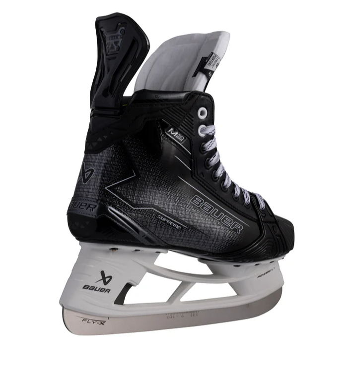 A photo of the Bauer Supreme M50 Pro Hockey Skates (2024) in colour black and grey. Angled rear view.