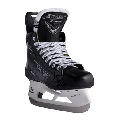 A photo of the Bauer Supreme M50 Pro Hockey Skates (2024) in colour black and grey. Angled view.