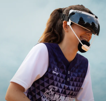 A photo of the Rip-IT Visor for Softball Fielder's Mask. Woman wearing demonstration. 