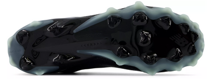 A photo of the New Balance Men's FreezeLX V5 Mid Lacrosse Cleats in colour black and white. Bottom view.