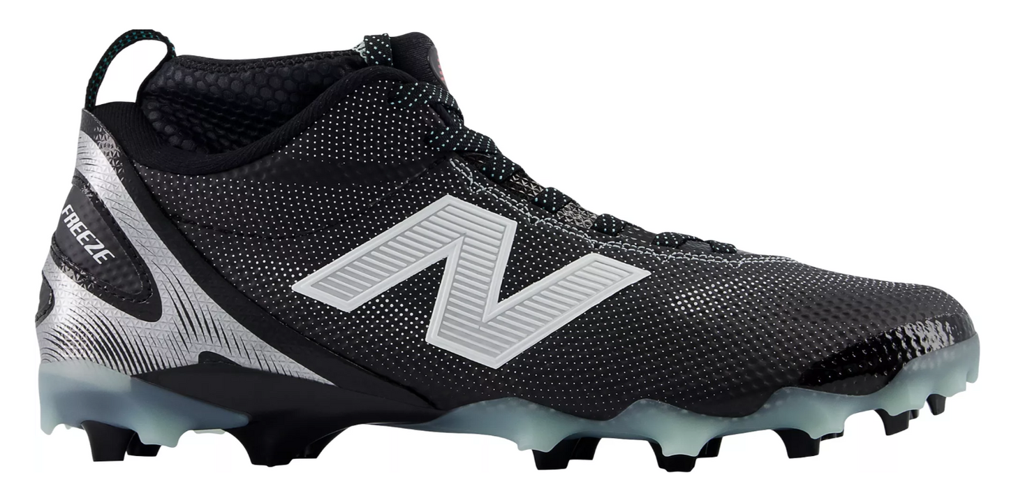 A photo of the New Balance Men's FreezeLX V5 Mid Lacrosse Cleats in colour black and white. Side view.