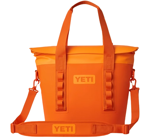 A photo of the Yeti Hopper M15 Soft Cooler in king crab orange