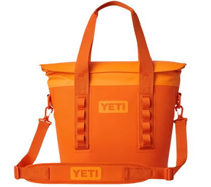 A photo of the Yeti Hopper M15 Soft Cooler in king crab orange
