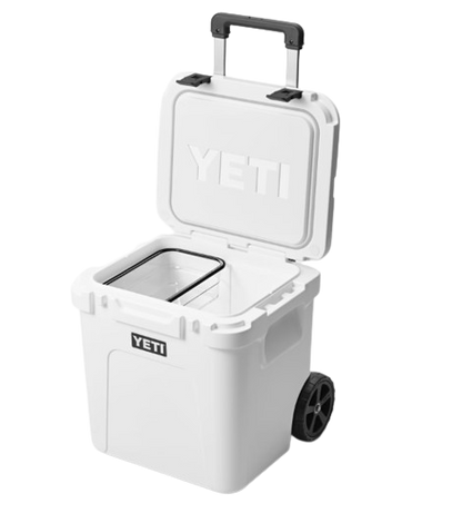 A photo of the Yeti Roadie 48 Wheeled Cooler in colour white, front, open-lid view.