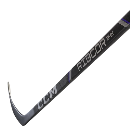 A photo of the CCM Ribcor Trigger 94K Hockey Stick in colour black. Blade view.