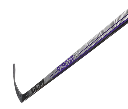 A photo of the CCM Ribcor 86K Hockey Stick in colour silver, black and purple. Side view. 