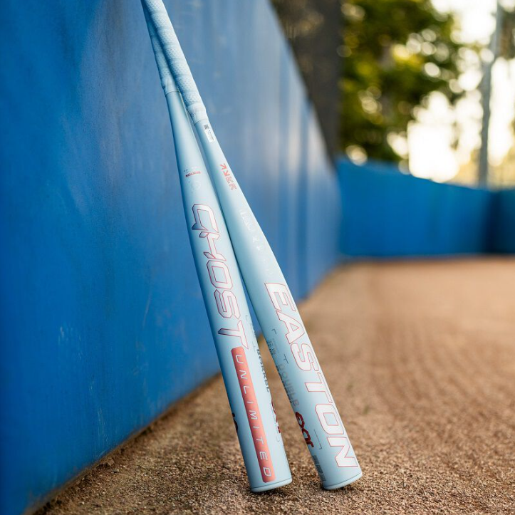 A photo of the 2025 Easton Ghost Unlimited -10 Fastpitch Softball Bat in colour white and orange. Outside view.
