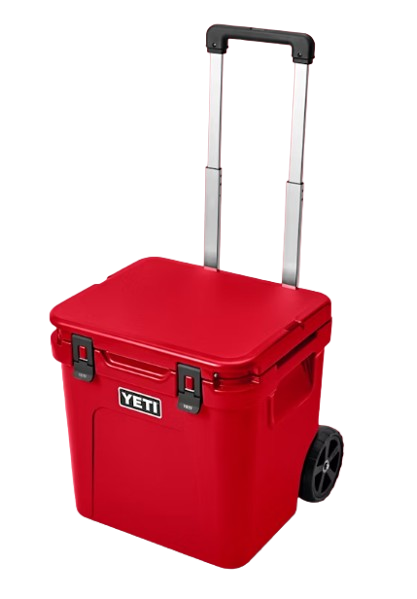 A photo of the Yeti Roadie 48 Wheeled Cooler in colour king rescue red, front, closed-lid view.