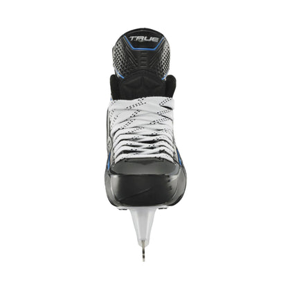 A photo of the True Hockey Catalyst 3X6 Hockey Skates (2026) in colouir black and blue with white laces and a silver TRUE logo.