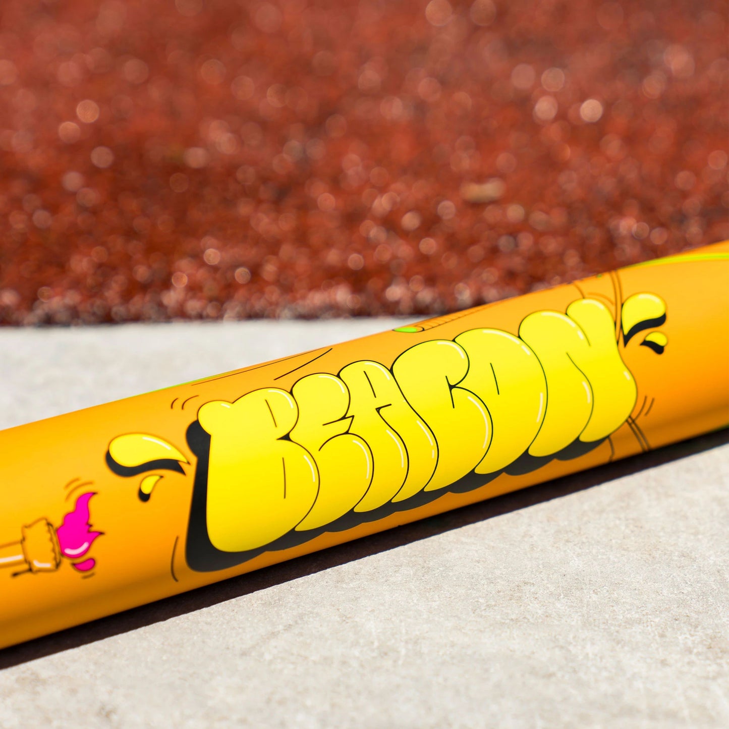A photo of the Victus Beacon Neon Orange USSSA YA-YA Load Slo-Pitch Bat in colour orange and green.