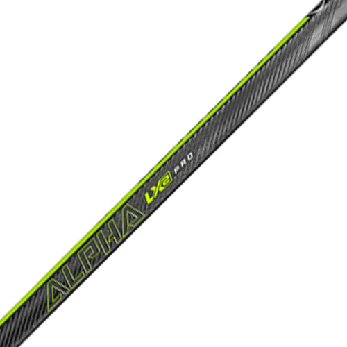 A photo of the Warrior Alpha LX2 Pro Intermediate Hockey Stick (2023) staff in colour black and green.