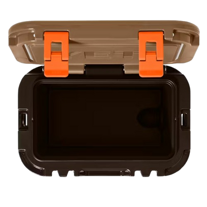 A photo of the Yeti Roadie 15 Hard Cooler in colour brown and orange.